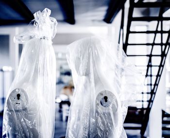 Close-up of mannequin on white wall