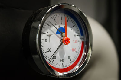 Close-up of clock on table