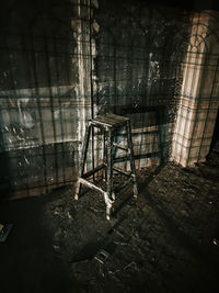 Empty chairs in abandoned building