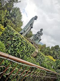 Low angle view of statue against sky