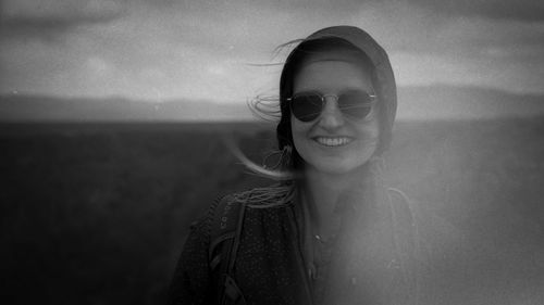 Portrait of young woman wearing sunglasses