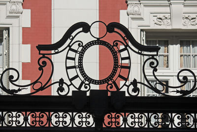 Close-up of metal railing against building