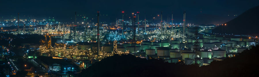 High angle view of illuminated buildings in city at night