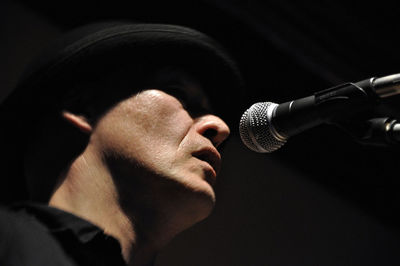 Close-up of man singing in concert