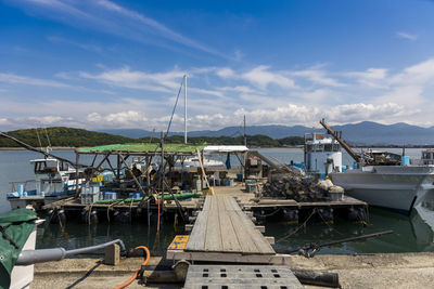 Boats moored at harbor