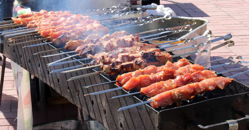 The meat, impaled on skewers, is fried on the grill. food close-up. summer holiday concept.