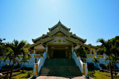 View of temple against clear blue sky