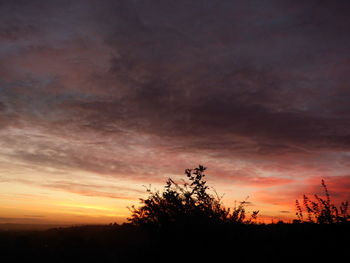 Silhouette landscape against scenic sky