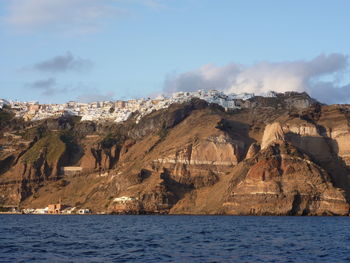 Panoramic view of sea and mountains against sky