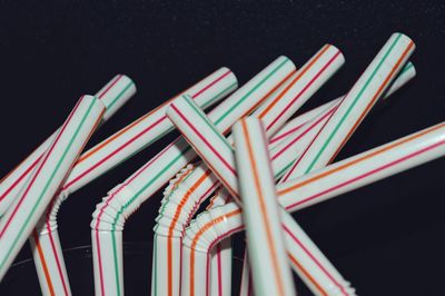 Low angle view of multi colored pencils at night