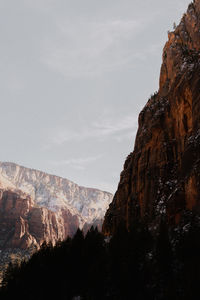 Snow covered mountain range against the blue sky