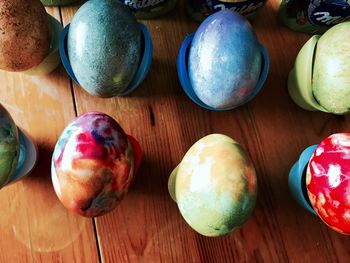 High angle view of multi colored eggs on table