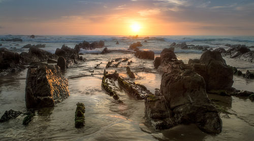 Panoramic view of sea against sky during sunset