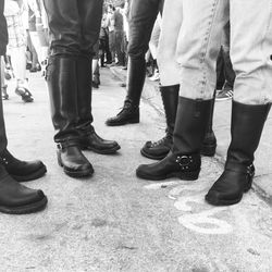 Low section of people standing on street