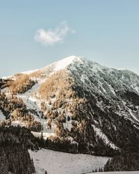 Low angle view of snow mountain against sky