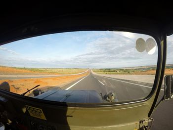 Road seen through car window