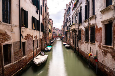 Canal amidst buildings in city