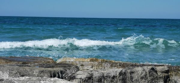 Scenic view of sea against clear sky