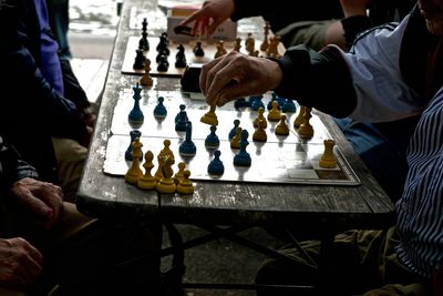 Low angle view of men playing on table