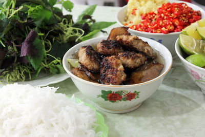 Close-up of meat in bowl at table