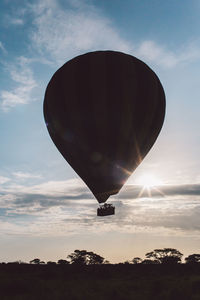 Hot air balloons against sky during sunset