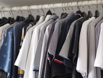 Clothes hanging on rack in store