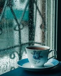 Close-up of coffee cup on table