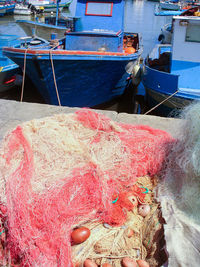 High angle view of fishing boats moored at harbor