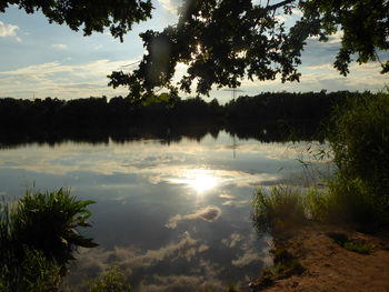 Scenic view of lake against sky during sunset