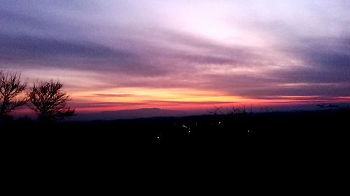 Silhouette of landscape against dramatic sky