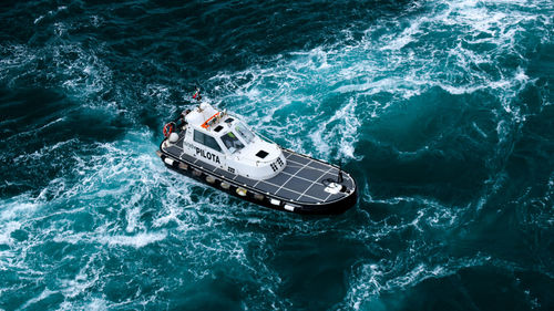 High angle view of ship sailing in sea