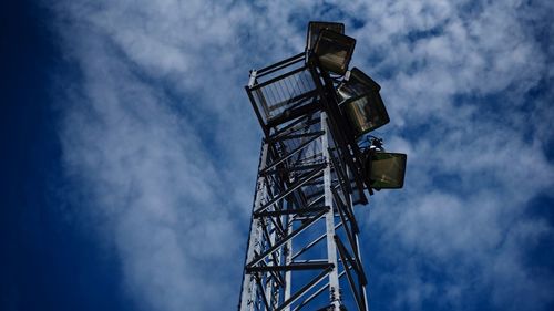 Low angle view of tower against blue sky