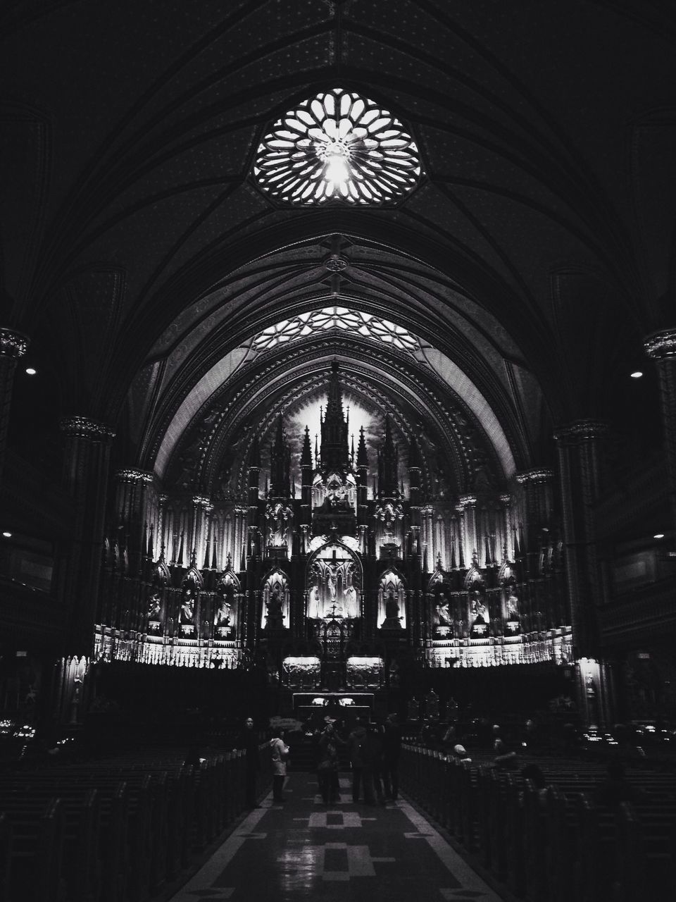 indoors, arch, illuminated, architecture, ceiling, men, built structure, travel, railroad station, interior, transportation, person, large group of people, incidental people, public transportation, lifestyles, travel destinations, leisure activity, night