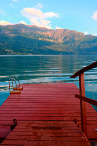 Pier over lake against sky