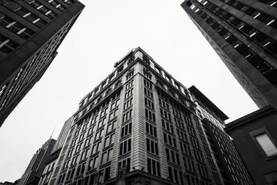 Low angle view of modern buildings against clear sky