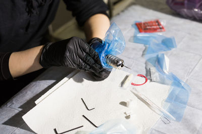 High angle view of man working on paper