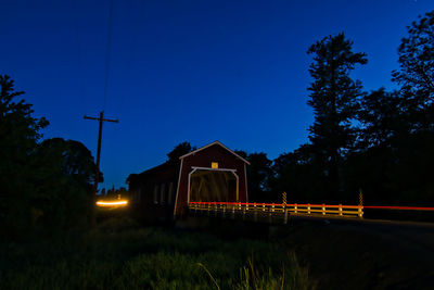 View of illuminated street lights at night