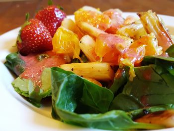 Close-up of chopped fruits in plate