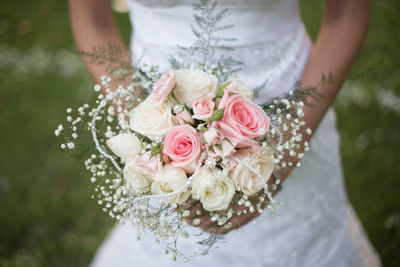 Close-up of woman holding flower bouquet