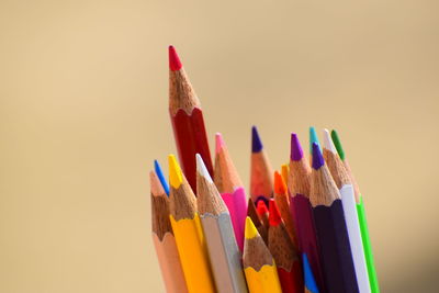 Close-up of colored pencils against white background