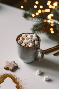 Hot cocoa with marshmallows and christmas cookies