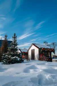 Cozy little vintage wooden houses decorated with new year's toys and garlands. 