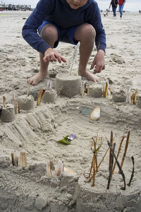 High angle view of woman sitting on beach