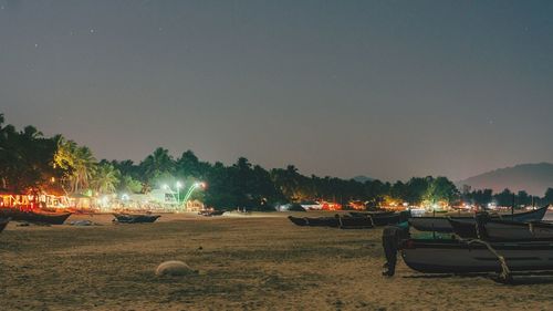 Boats moored at agonda beach at dusk