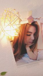 Young woman lying on bed at home