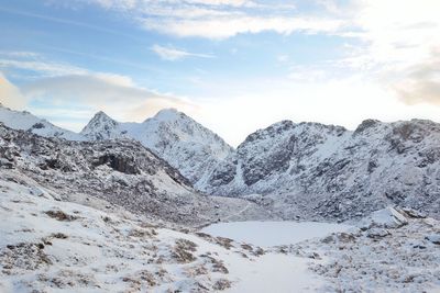 Scenic view of mountains against sky during winter