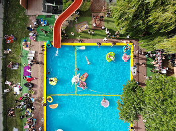 High angle view of people by swimming pool