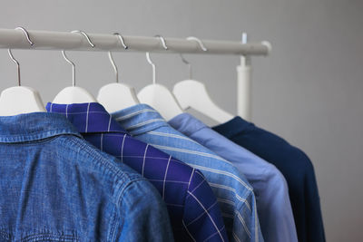 Close-up of clothes hanging on rack