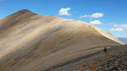 Tourists walking on sand
