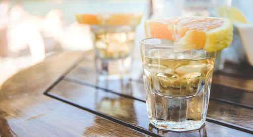 Close-up of shots in glass on table